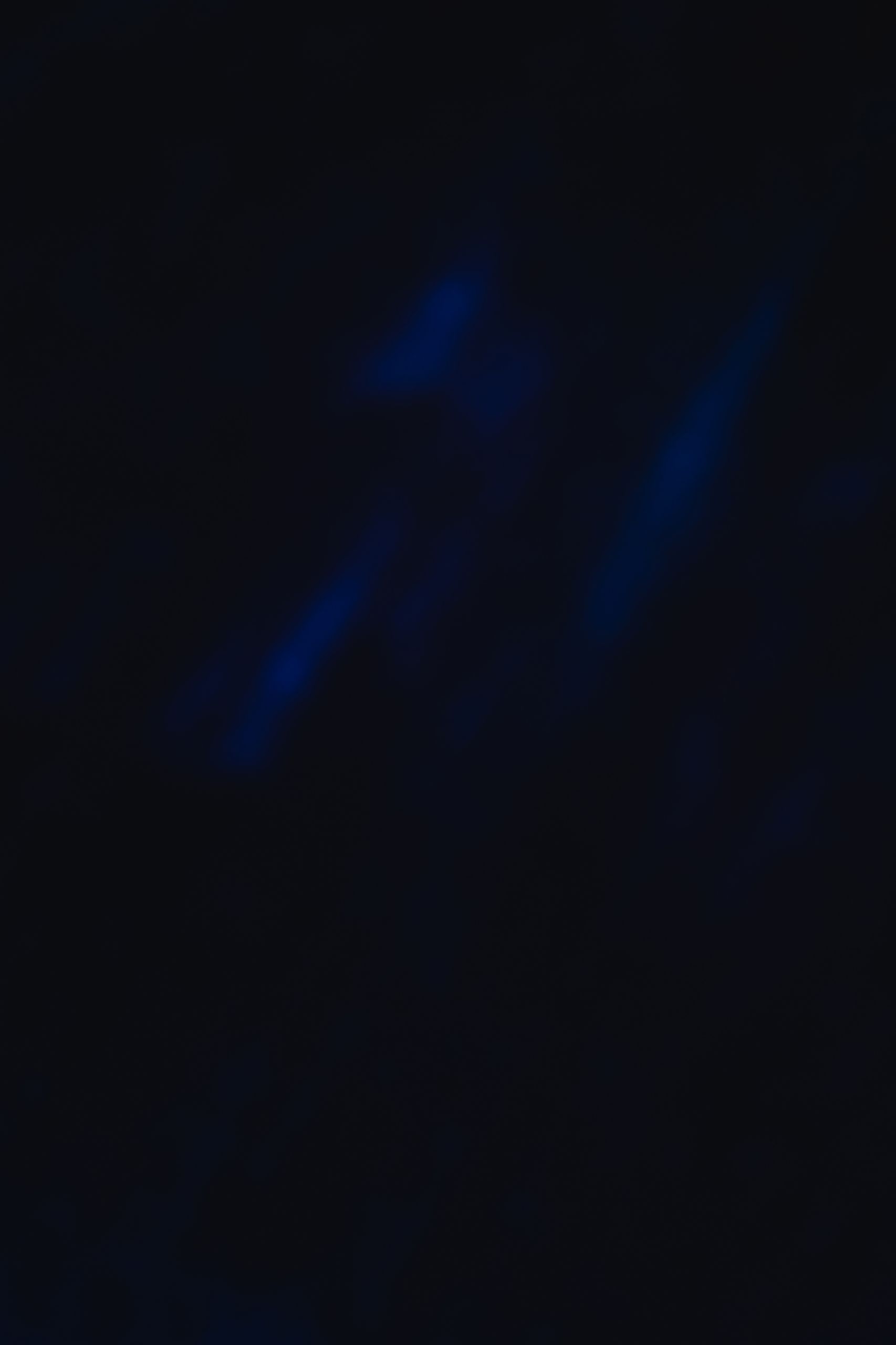 An abstract dark blue textured background with blurred elements, perfect for design projects.